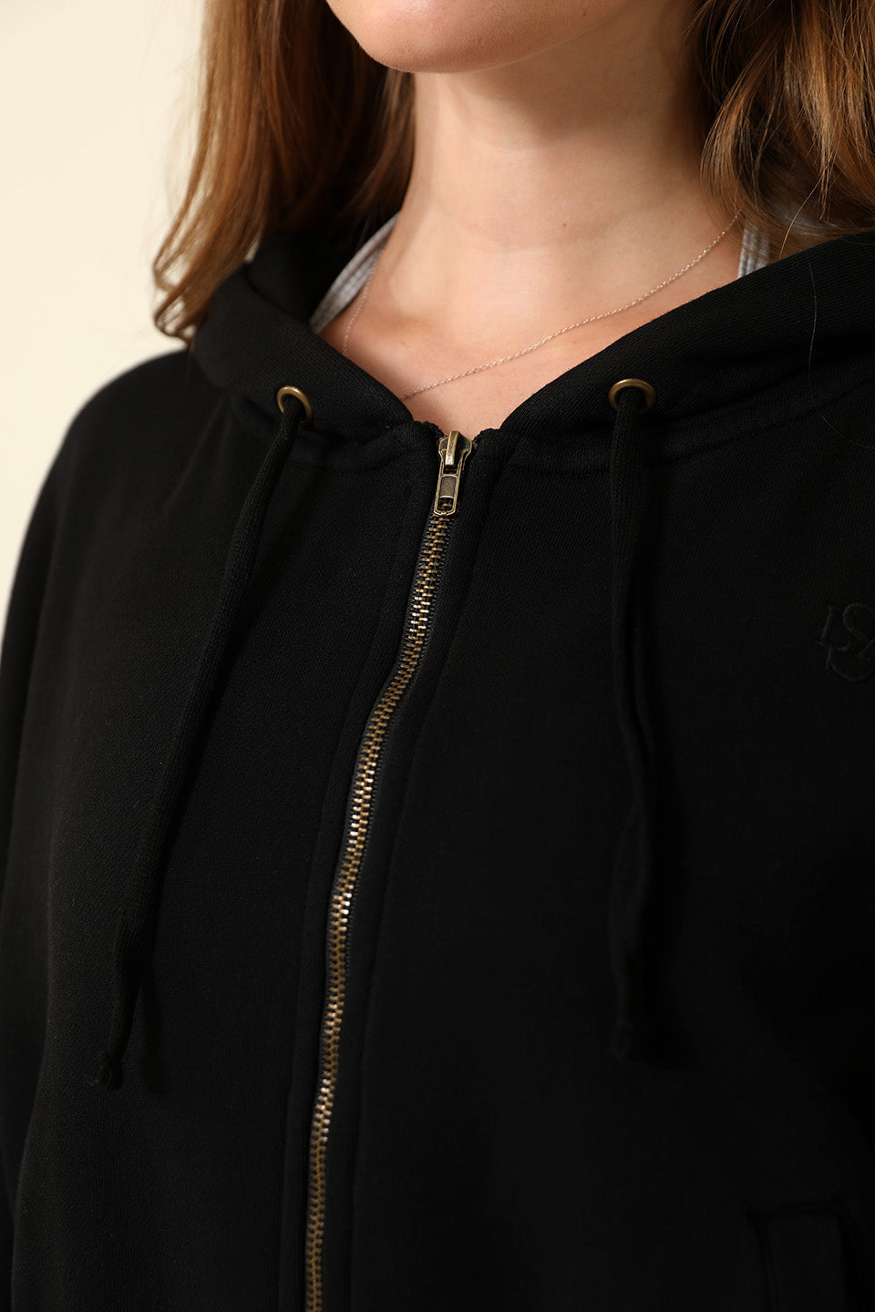 Model wearing the Breeze Zip-Up Fleece Hoodie in Noir